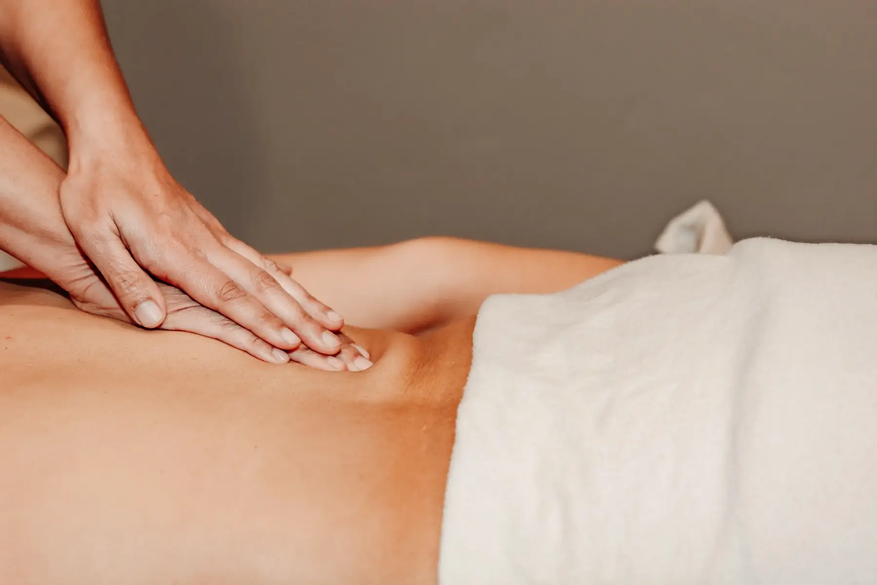 A skilled practitioner performs massage and bodywork on a client at Concept Wellness.